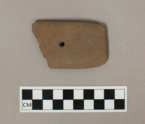 Ground stone, perforated gorget fragment