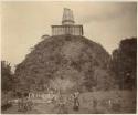 Buddhist monk standing in front of stupa