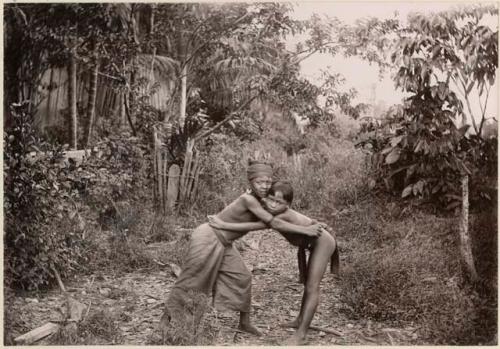 Two boys with their arms around each other