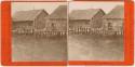Stereoview of buildings on stilts in water