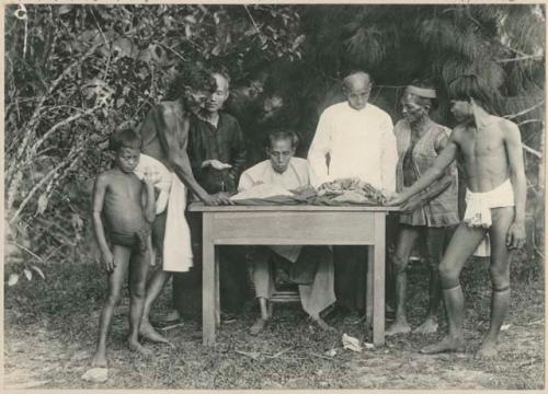 Men selling camphor to Chinese traders