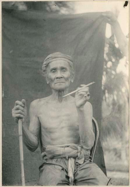 Man with staff and pipe