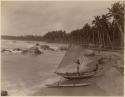 Fishing boat and people along shore