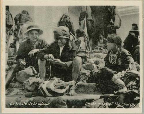 Group sitting on steps of a church