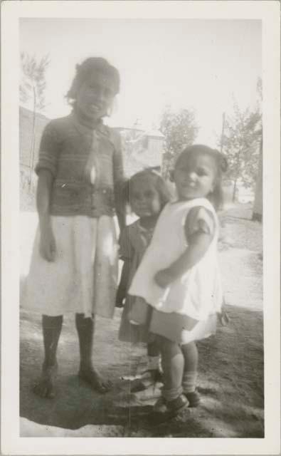 Three children in frame, possibly in Antigua