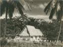 Thatched-roof building, center frame