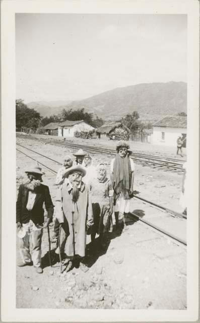 People wearing masks on railroad tracks between Barrios and Zacapa