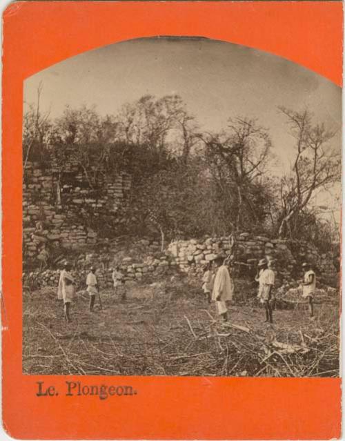 Men standing at the location of the Grand Stairway of the Palace of the Priests