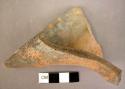 Potsherd [A]; fluted potsherd [B] - both are local red burnished ware. A is mere