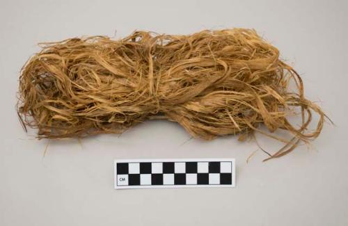 Bundle of shredded bark from cradle and equipment