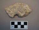 Perforated soapstone disk fragment