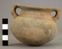Wide mouthed pottery jar with two handles - Scarified ware