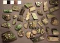 27 fragments of various greens and one black jade tubular beads with decorated e