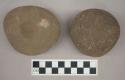 Ground stone, double pitted grinding stones