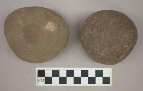 Ground stone, double pitted grinding stones