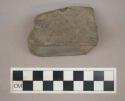 Ground stone, squared fragment