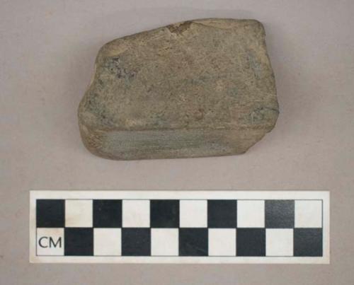 Ground stone, squared fragment