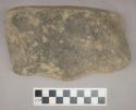 Ground stone, grooved axe, one side has a flat base