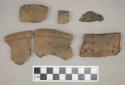 Ceramic, earthenware, body and rim sherds with impressed decoration, some sherds mend