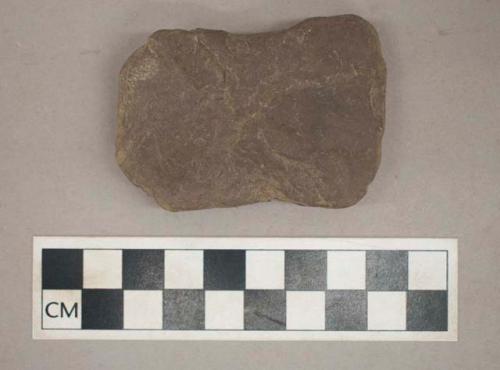 Ground stone, side-notched, possible weight