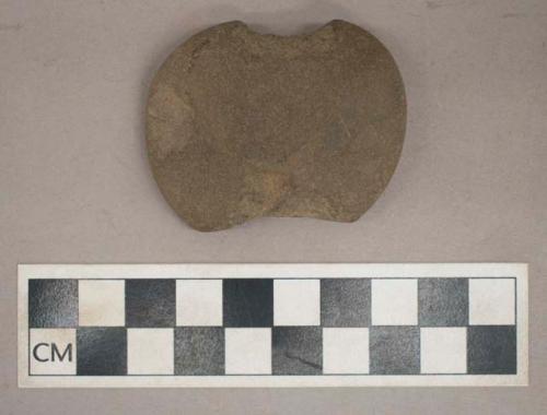 Ground stone, side-notched, possible weight