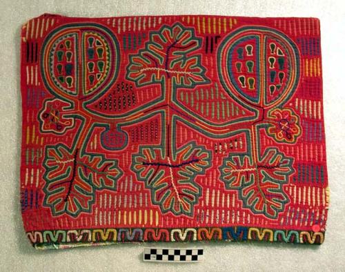 Pair of matching molas, sewn together for use as a pillow case.  Primarily red.