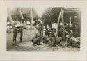 Men making a net for catching wild boars