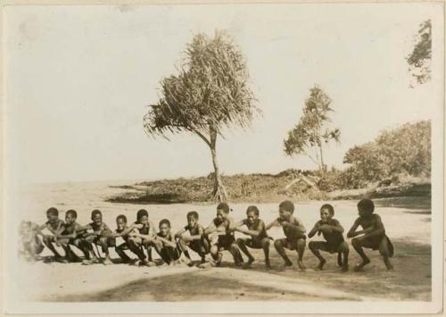 Boys playing the wallaby race game