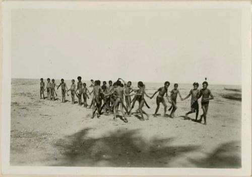 Boys playing the 'mogas viriviri' game