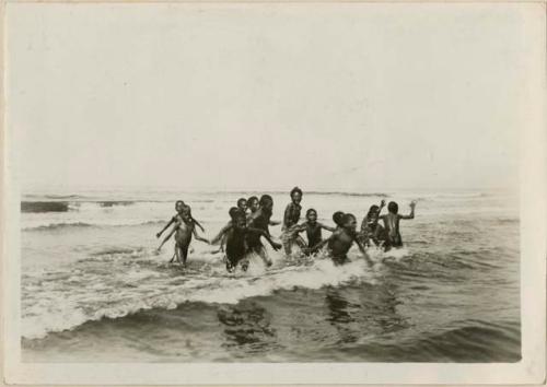 Boys playing in the sea