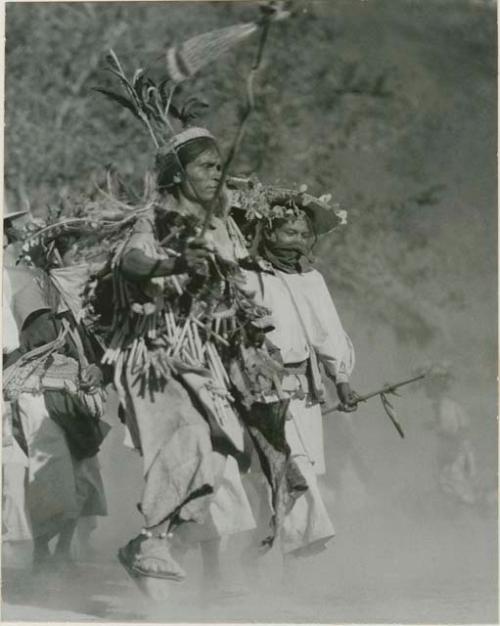 Dancers during Peyote fiesta at Pochotita led by the devil-man