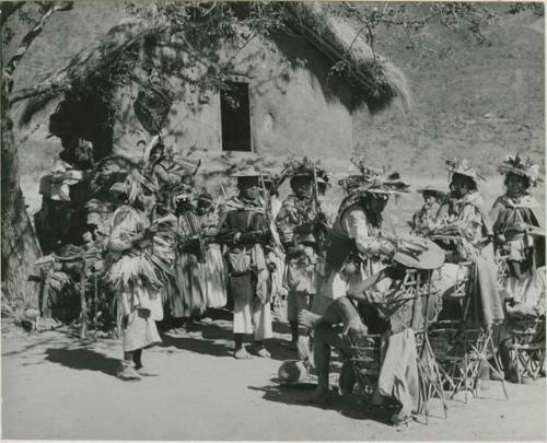 Leaders of Peyoteros presents the singing shaman with first fresh peyote plant at the Feast of Hikuli