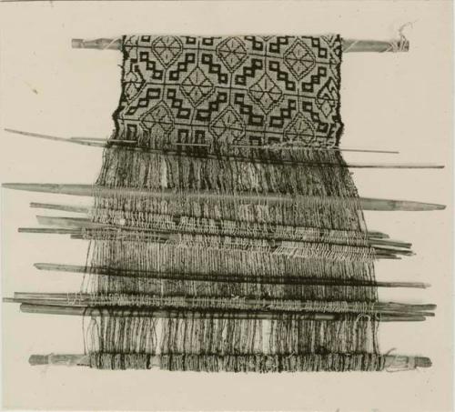 Loom and woven textile