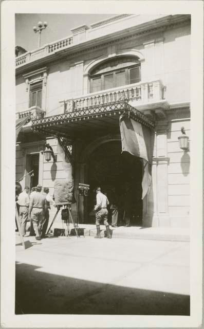 Street scene, men with a camera on tripod