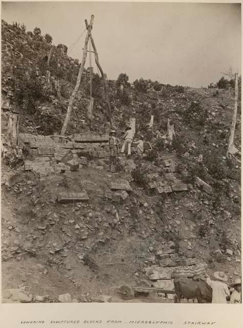 Lowering sculptured blocks from hieroglyphic stairway