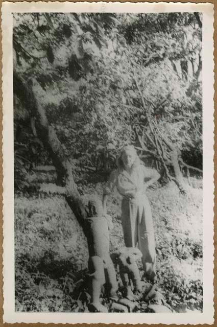 Eleanor Lothrop with stone figure at Las Mercedes