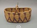 Oblong utility basket with handle. Coil technique. Made of bear grass. Geomet