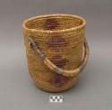 Large cylindrical utility basket with handle. Made of bear grass (natural and d