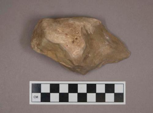 Hand axe with large amount of cortex and one end being worked to a thin point