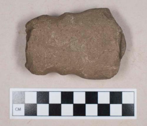 Ground stone, double grooved axe fragment