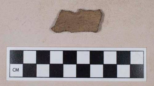 Ceramic, earthenware, rim sherd with impressed decoration