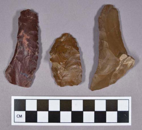 Chipped stone, blades, flake scrapers, one bifacial fragment, and one diamond-shaped projectile point, jasper