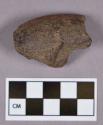 Ground stone, fragment; possible pipe bowl fragment