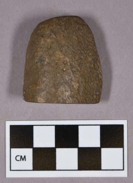 Ground stone, modified lithic, cobble fragment with burnished flat surface; possible rubbing stone