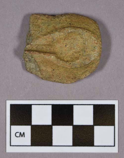 Ground stone, fragment; possible platform pipe fragment