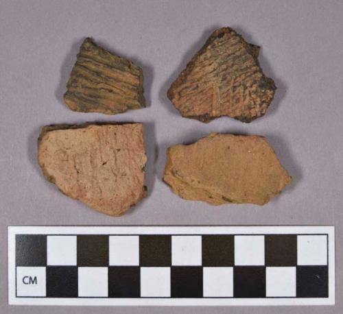 Ceramic, earthenware rim and body sherds, cord-impressed, includes grit- and mica-tempered