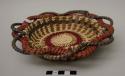 Decorative, spaced-stitch coiled pine needle and raffia tray with openwork rim, red and green stitching
