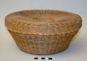 Covered sweetgrass work basket with 4 small covered sweetgrass baskets