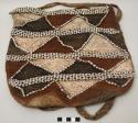 Woven bag with red, white and black triangles delineated by coix seeds; strap