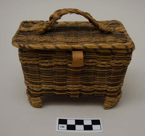 Oval shaped, covered sewing basket